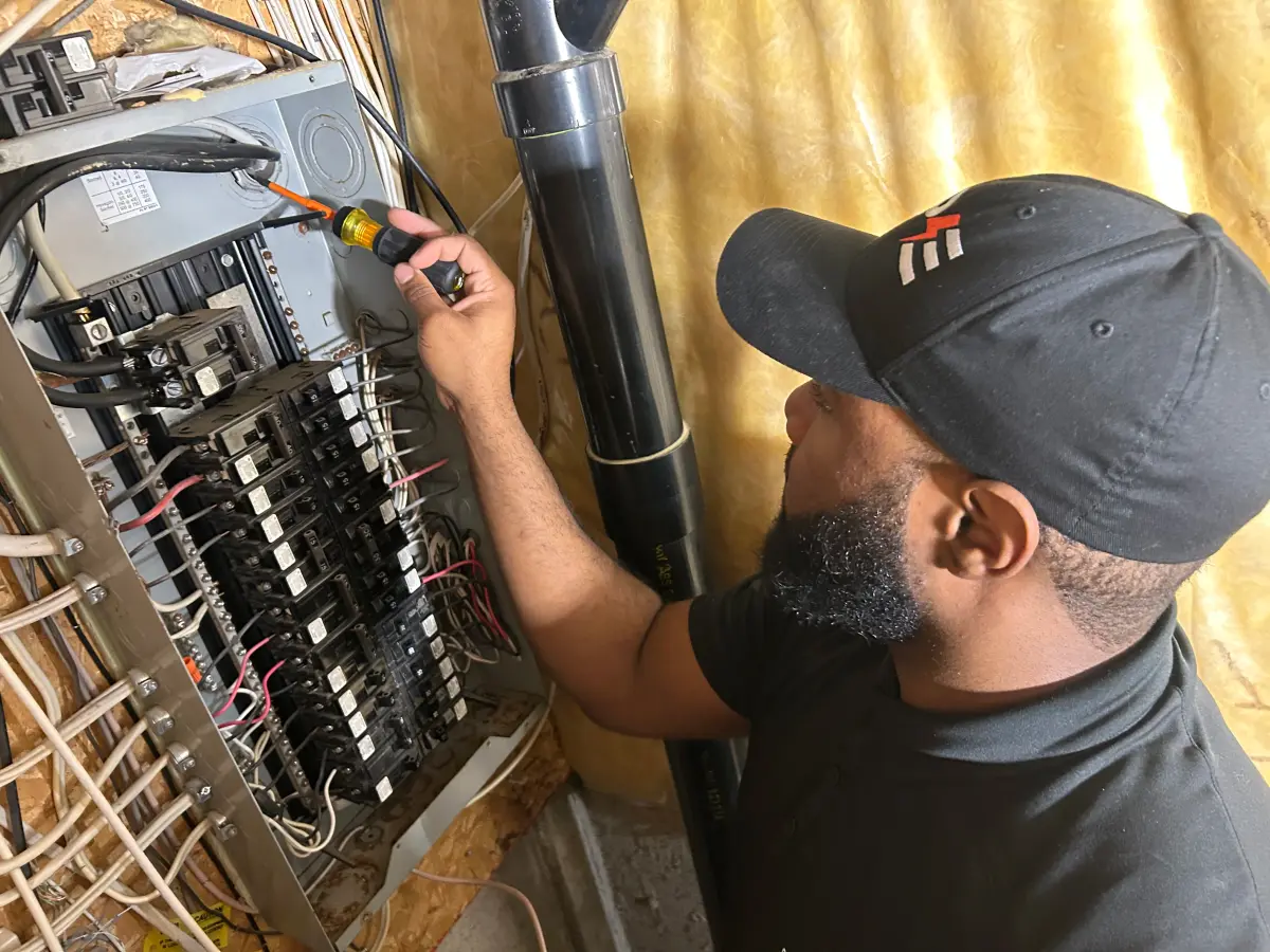 Licensed electrician in Brampton performing panel upgrade
