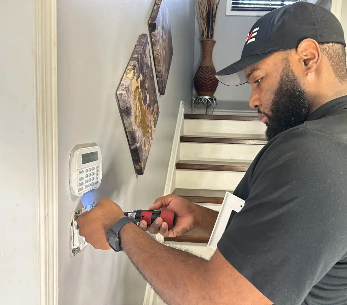 Shaun installing outlet in residential home